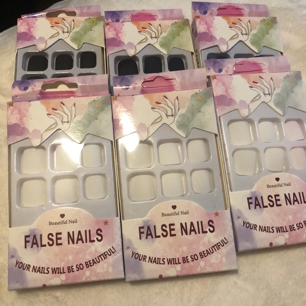 6 pack of press on toe nails. 3 white and 3 black.